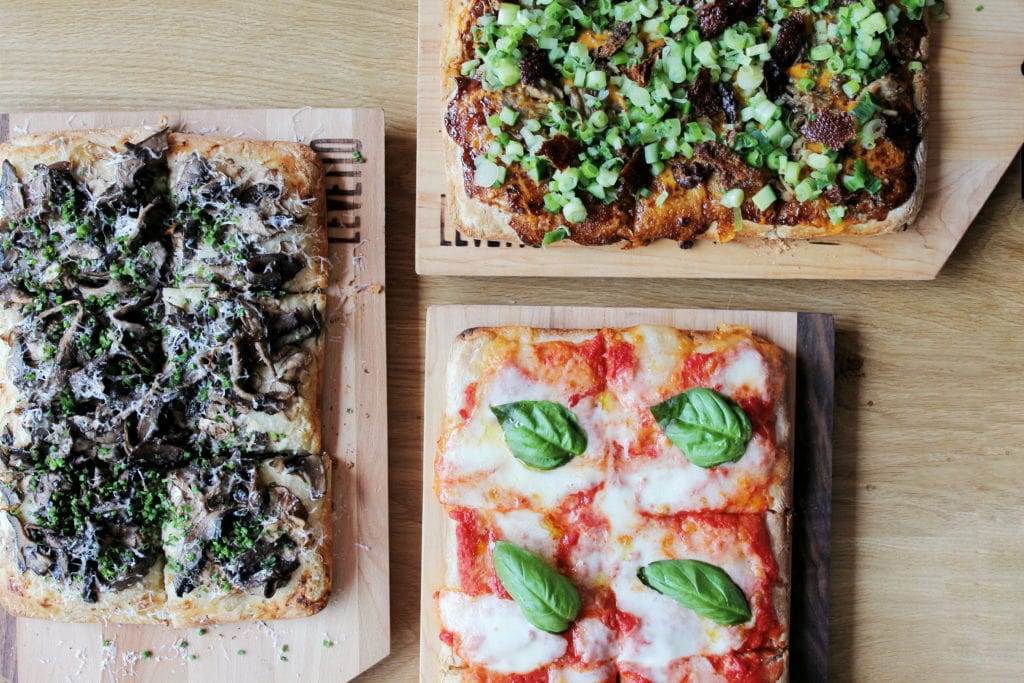 Levetto Pizza, Funghi (left), Peking Duck (top right), Margherita (bottom right)